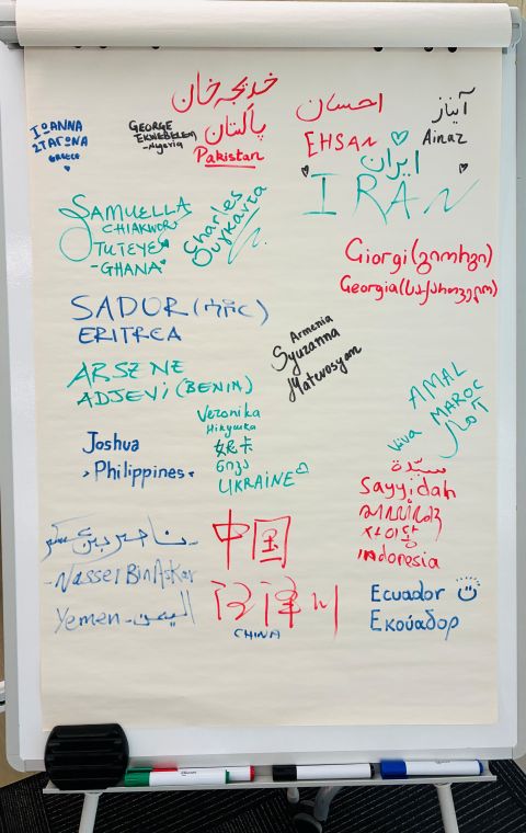 Flipchart with the names and countries of the participants